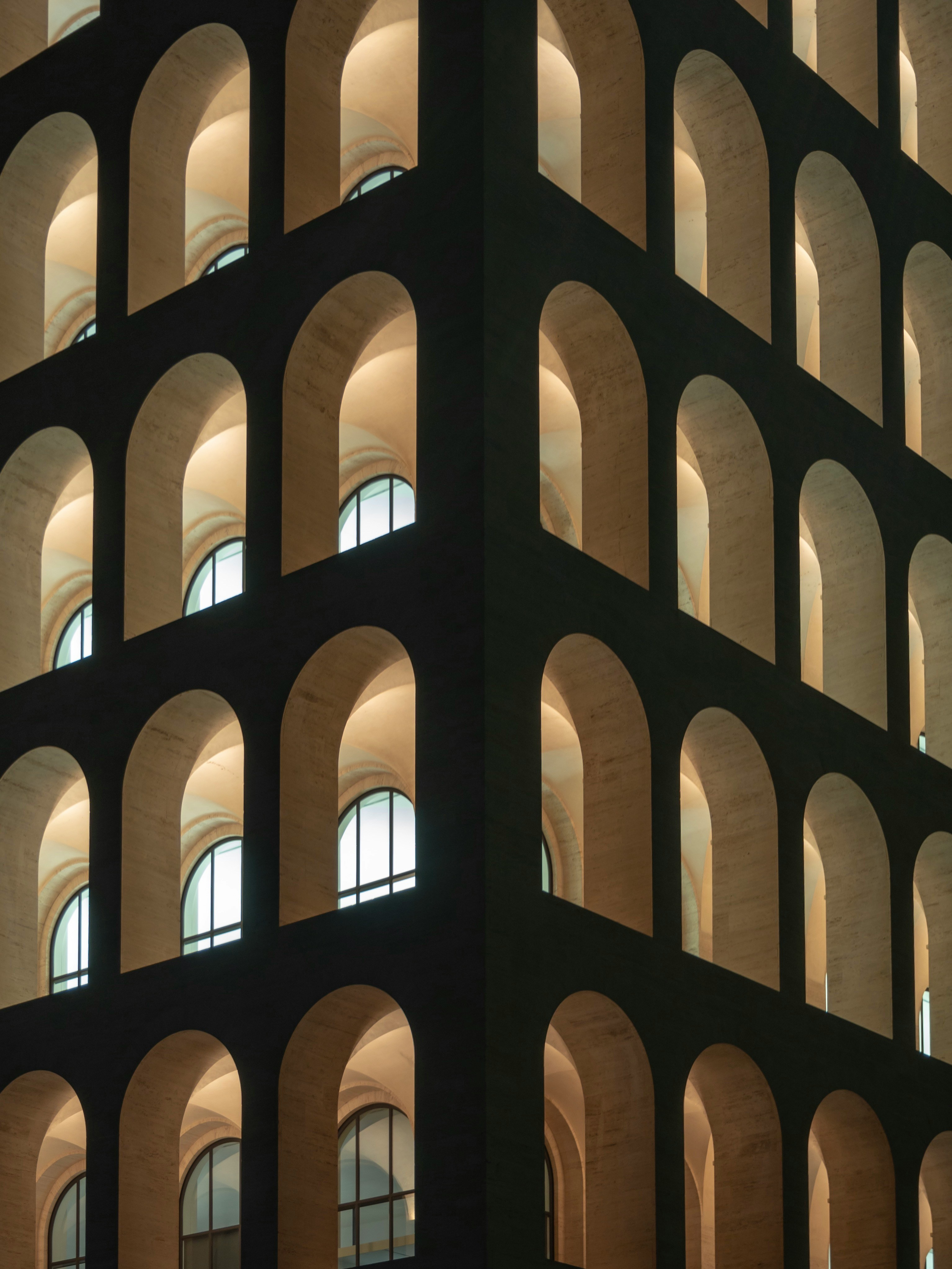 Rows of identical arches on a building facade — distinct things reduced to sameness